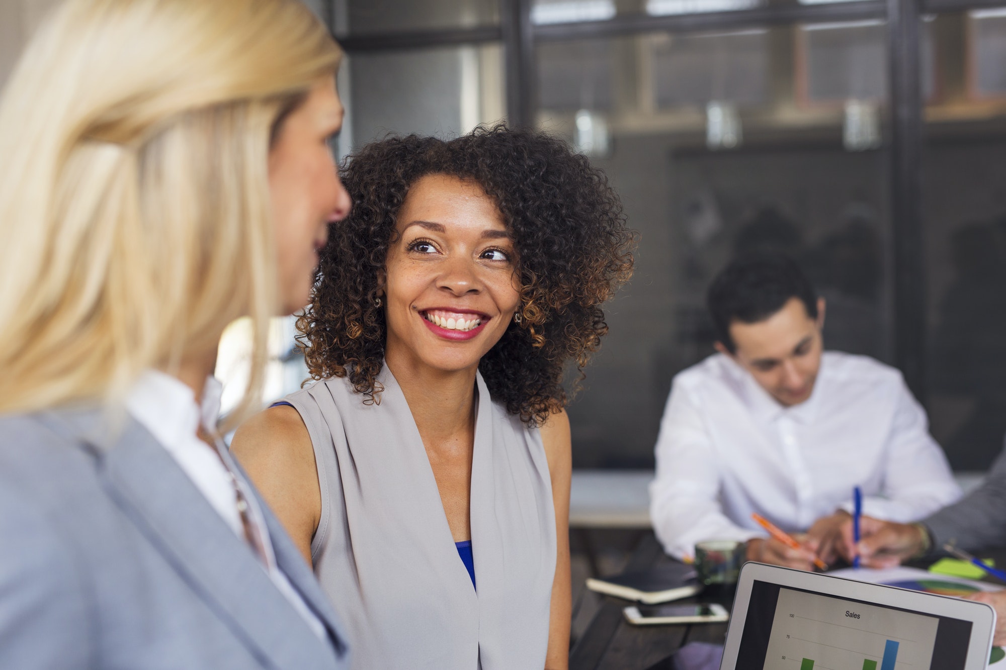 Business people laughing in office